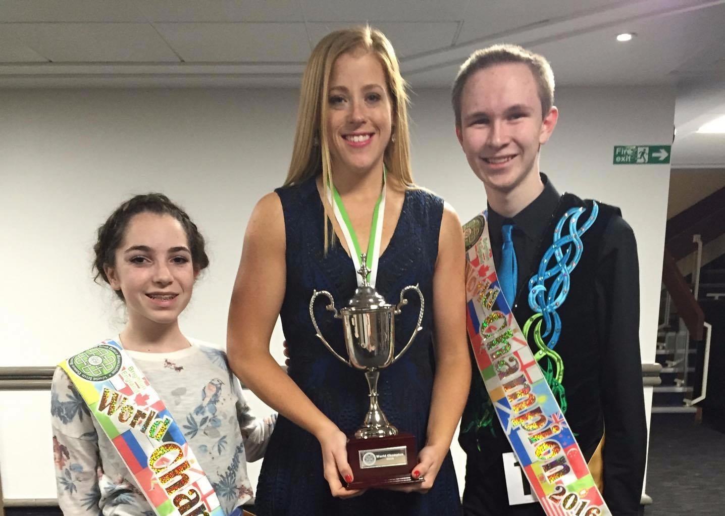 Emerald Isle Academy's two world champions with their instructor, Kate O'Brien.