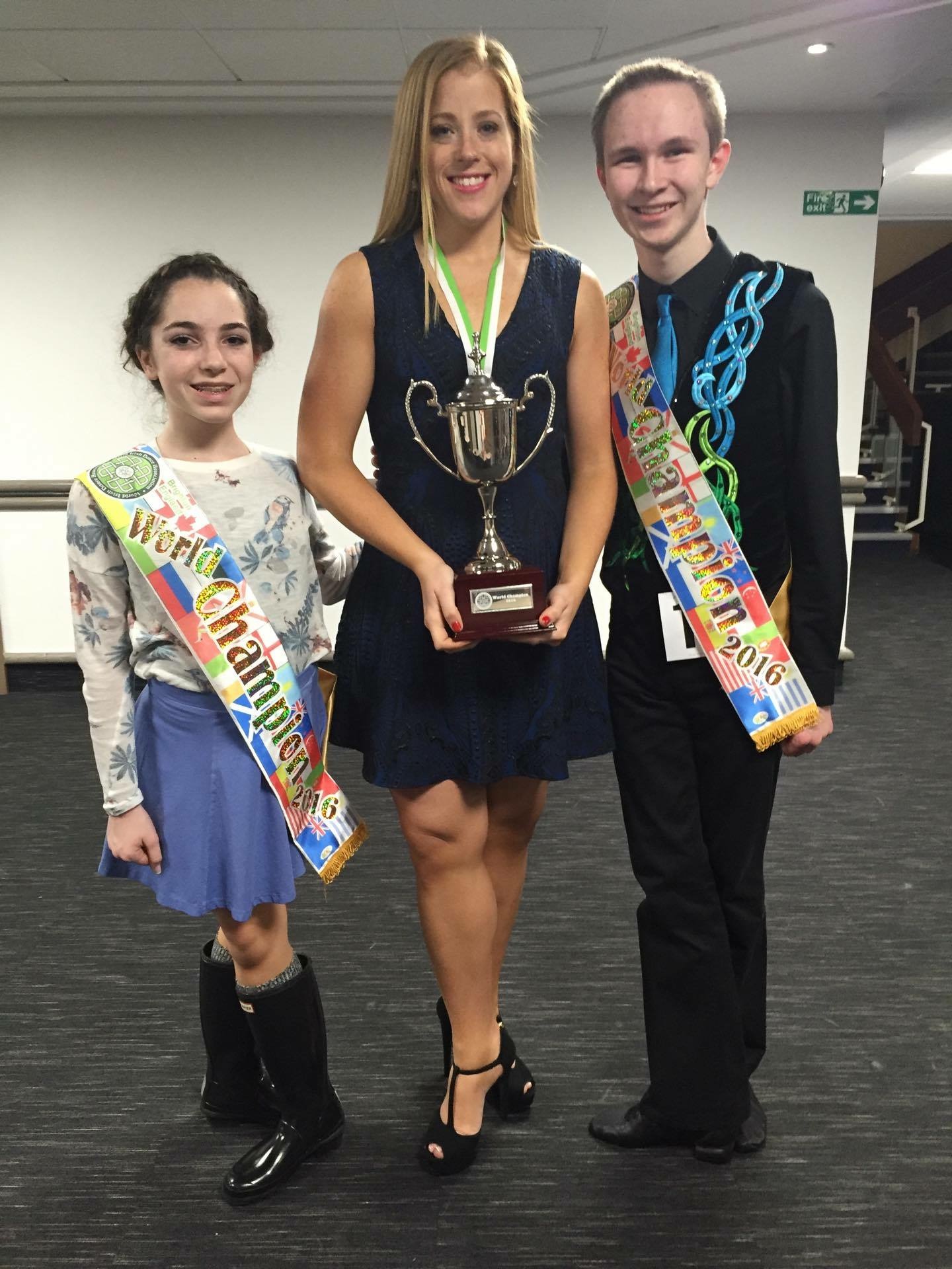 Angela Brunetti and Matthew Jones pose with their teacher, Kate O'Brien, after both winning the 2016 WIDA World Championships